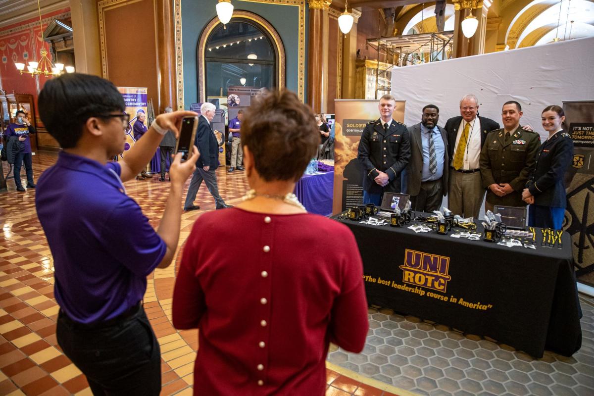 UNI Day at the Capitol: Representative Steve Bradley getting his photo taken with UNI's ROTC